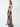 a female model wearing a handmade black yvy leather dress made with leather straps