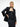 A female model wearing the black tube dress with tailored black yvy suit jacket, paired with the statement leather belt with metallic buckle 