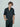 man wearing yvy leather men's jumpsuit with buckle belt 3 and phone case