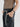 close up of man wearing yvy leather eyelet bracelet with eyelet belt and net top