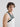 side profile of male model wearing yvy leather uni shoulderpiece in black over a white tank top