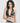 model wearing black yvy leather wrap bra and denim jeans