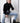 woman wearing black turtleneck and jeans with yvy leather moon bag over neck with shoulderstrap