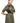 Woman wearing yvy olive green button-up shirt dress with a black harness featuring silver hardware. The dress features long sleeves, a fitted waist, and a high slit for a bold, complementary style.