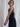 woman wearing yvy black leather neck strap with silver rivets on pants