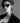 female model wearing sunglasses attached to the studded leather yvy sunglasses strap