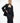 A female model wears the tube dress paired with the eileen body piece and suit jacket