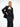 A female model wears the tube dress paired with the eileen body piece and suit jacket