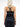 Back view of female model wearing a black leather yvy harness with criss-crossed straps over a strapless black dress, featuring double buckle details for an edy, structured look