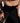 woman wearing black midi leather yvy skirt featuring plisse fabric detail 