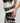 white and black yvy eyelet belts wrapped around the female body