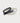 thin two-tone black and white yvy leather eyelet belt with silver and gold hardware