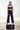 a female model wearing yvy accessories with black yvy trousers 7/8 length