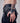 a woman wearing yvy asymmetric black leather hand accessory with leather straps 